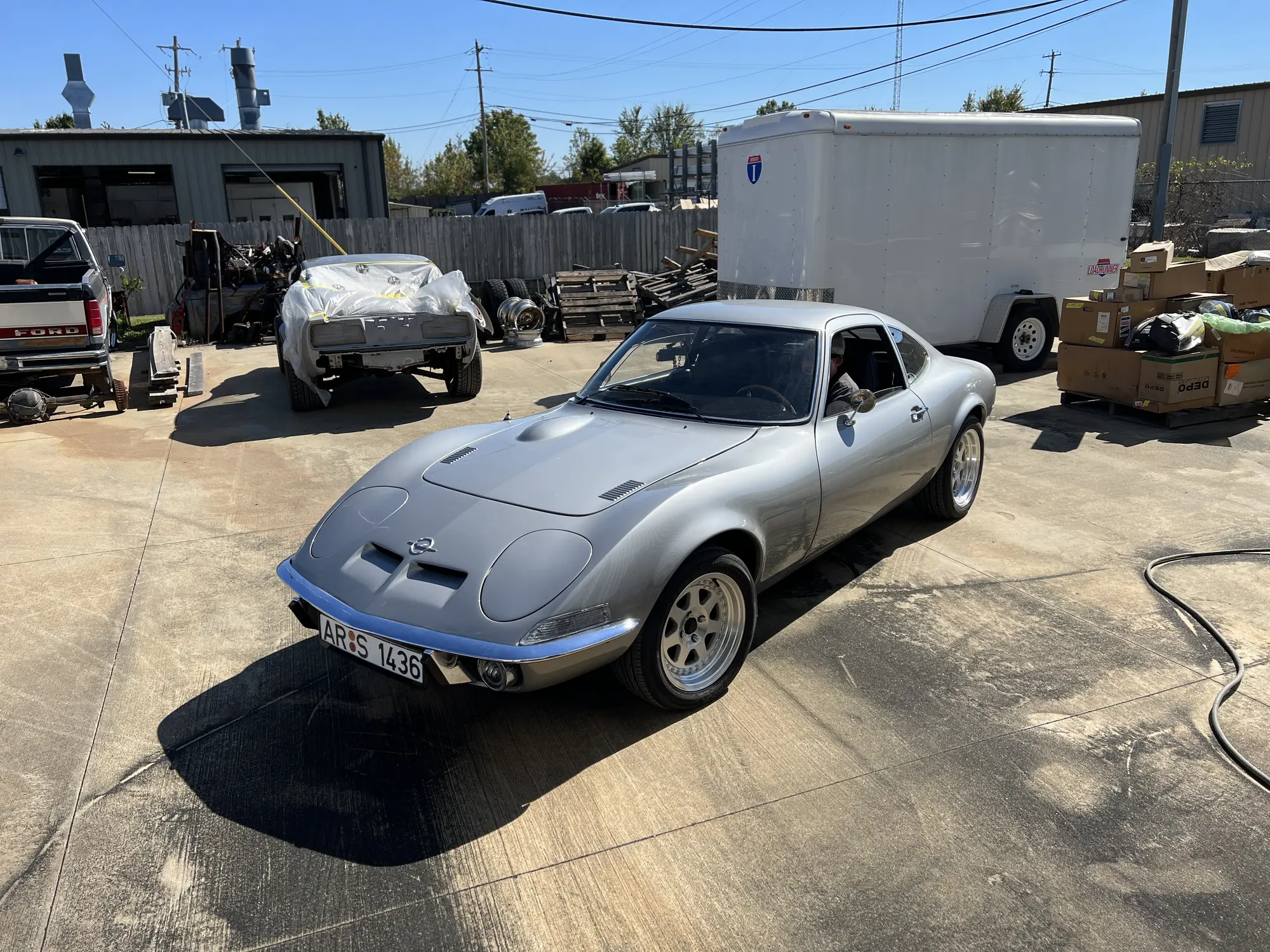 Silver Opel GT outside The Restomod Garage