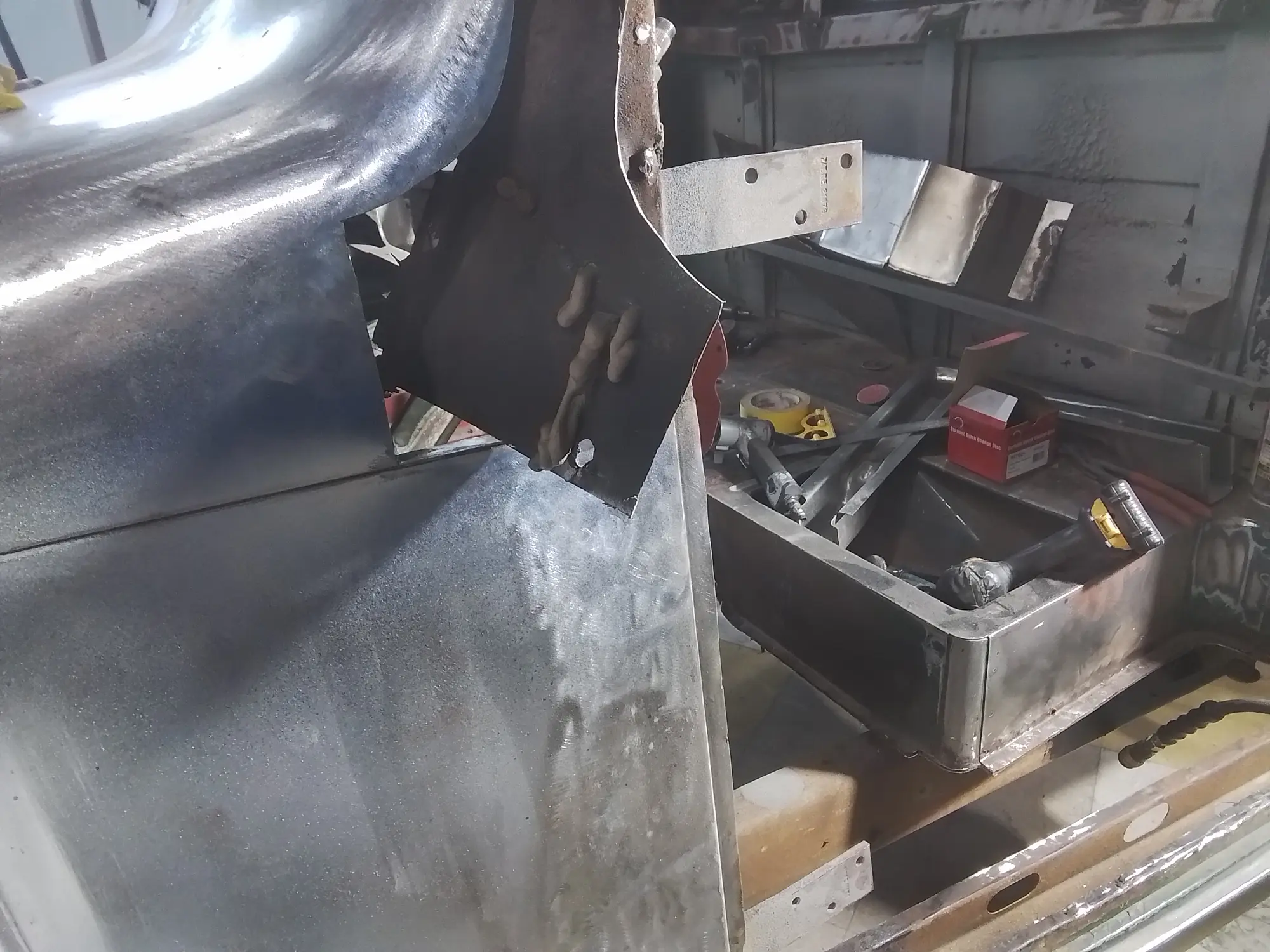 Bodywork in progress in the restoration workshop