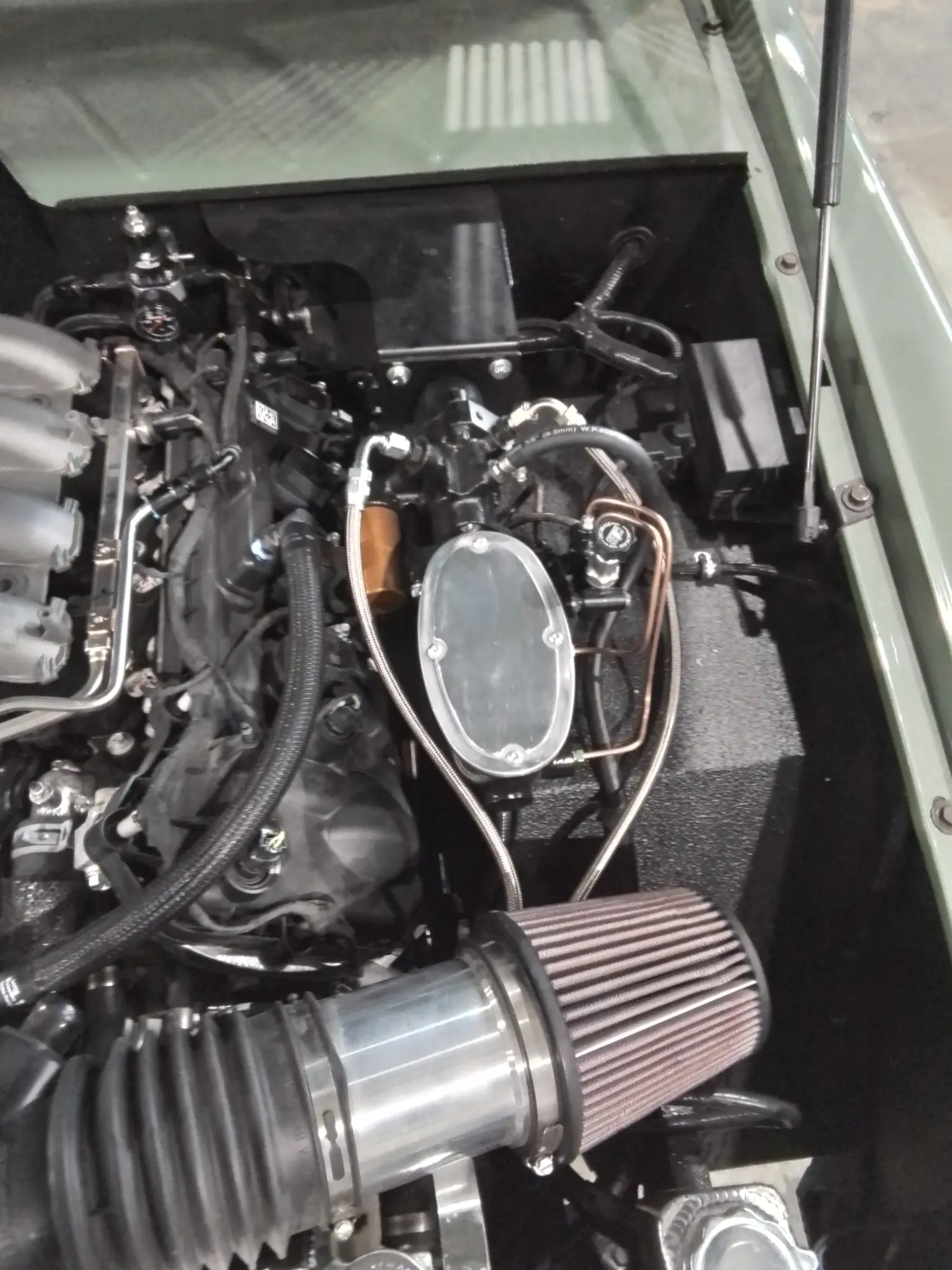 Engine-bay work at The Restomod Garage