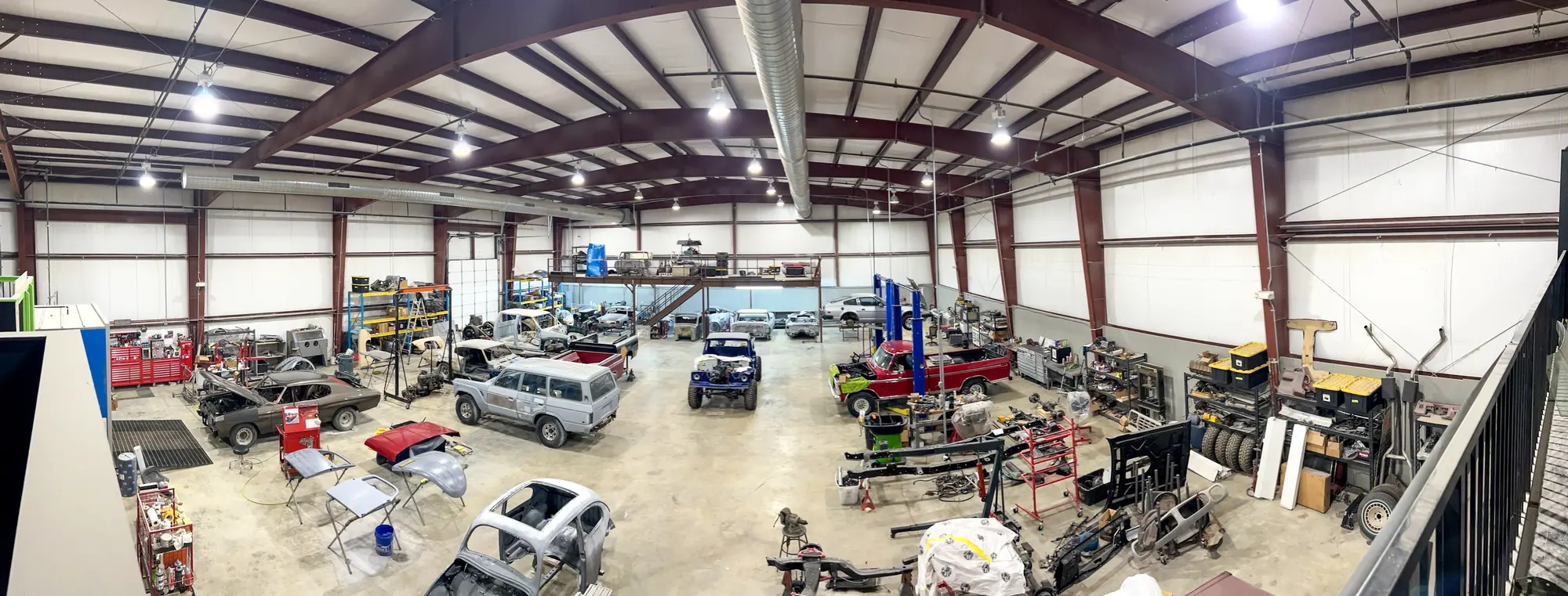 Wide view of the working restoration facility at The Restomod Garage